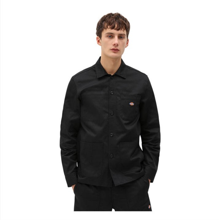 Black button-down men's shirt in cotton, with three patch pockets on the front, one inside pocket and hidden snap closure on the cuffs.