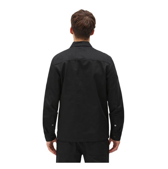 Black button-down men's shirt in cotton, with three patch pockets on the front, one inside pocket and hidden snap closure on the cuffs.